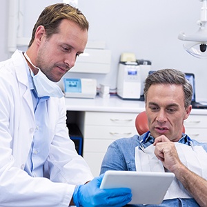 a patient speaking with their dentist
