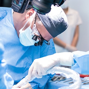 an oral surgeon placing dental implants
