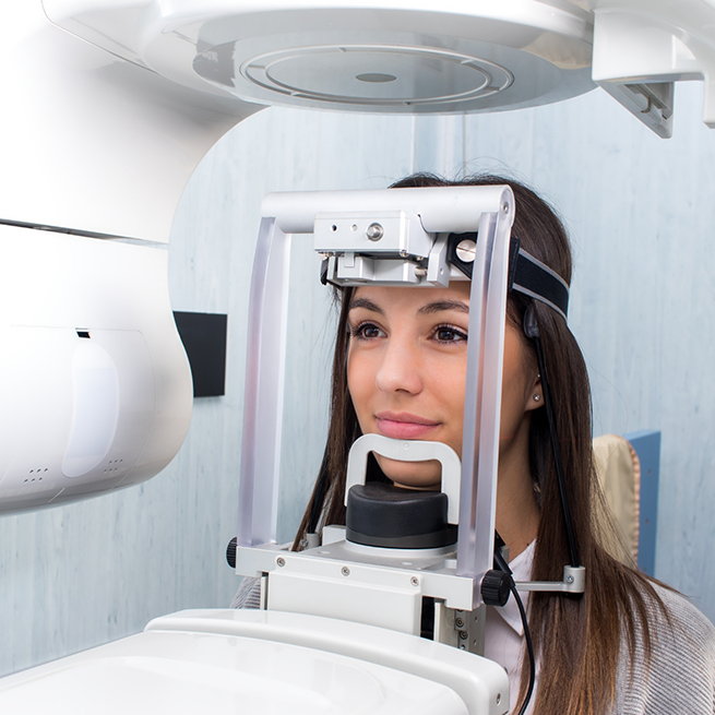 Female patient with cone beam scanner