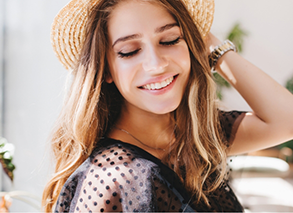 Smiling woman in straw hat