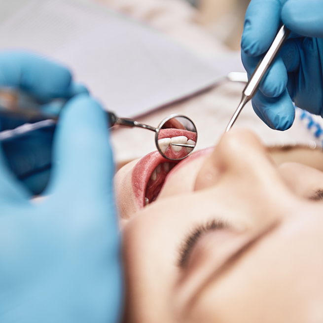 Female patient receiving checkup for preventive dentistry in Bloomfield