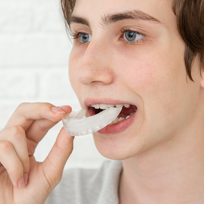 Boy opening mouth to put in mouthguard